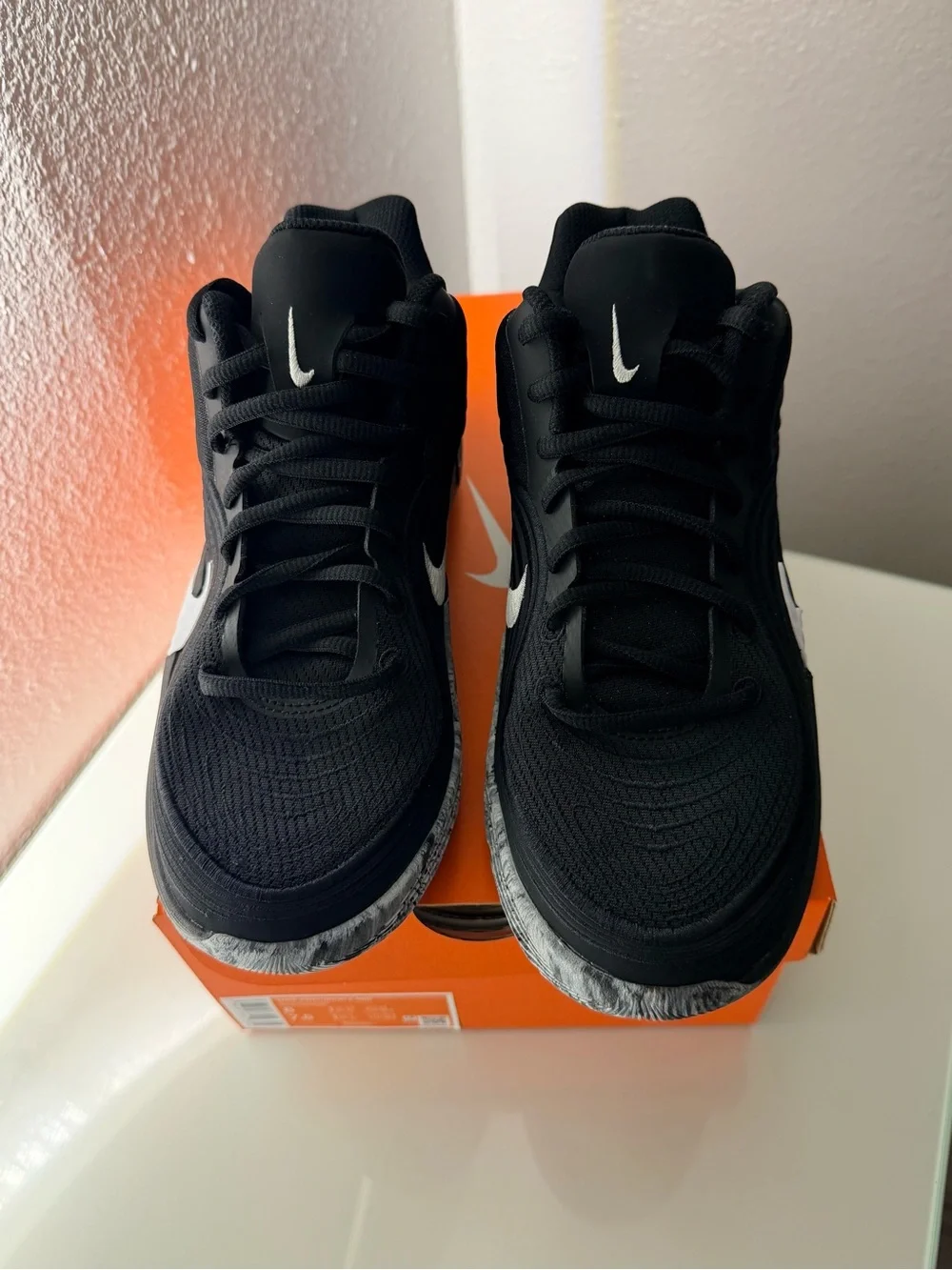 Nike Men’s Black Sneakers with White Swoosh